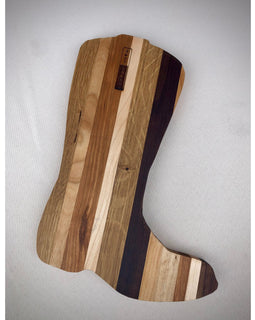 Wooden cutting board with a natural, multicolored grain pattern on a light gray background