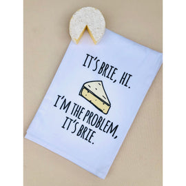 White flour-sack kitchen towel with the phrase “I’m Brie, Hi, I’m the Problem, It’s Brie” in playful text, ideal for Swifties and cheese lovers.


