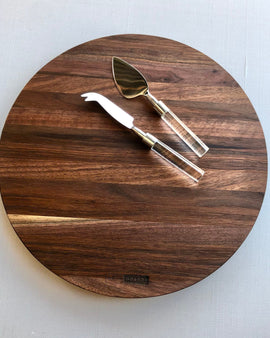 Round handcrafted walnut charcuterie board with rich natural wood grain by Nash Boards