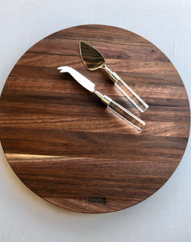 Round handcrafted walnut charcuterie board with rich natural wood grain by Nash Boards