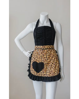 Leopard print apron with black heart pocket and ruffled trim displayed on mannequin