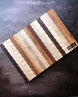 Handcrafted Music City charcuterie board made from cherry, maple, and walnut hardwoods by Nash Boards