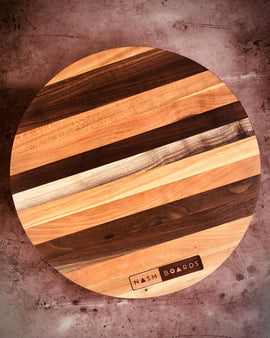 Round handcrafted Vols charcuterie board made from cherry and walnut hardwoods by Nash Boards