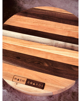 Round handcrafted Vols charcuterie board made from cherry and walnut hardwoods by Nash Boards