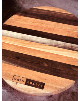 Round handcrafted Vols charcuterie board made from cherry and walnut hardwoods by Nash Boards