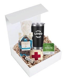 Corporate welcome gift box with customizable tumbler, salted chocolate caramels, peppermint mints, lip balm, and mini first aid kit