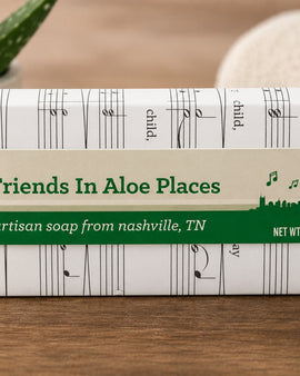Artisan soap bar from Friends In Aloe Places with a musical note design on the packaging.