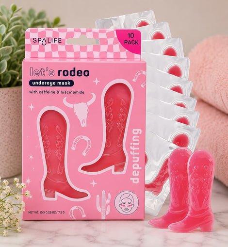 SpaLife rodeo-themed undereye mask packaging with pink cowgirl boot design on a marble surface.