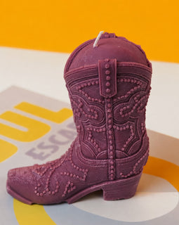 Purple cowboy boot on a colorful background