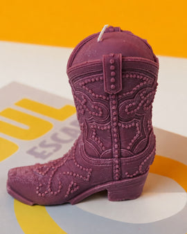Purple cowboy boot on a colorful background