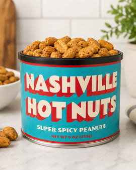 Canister of Nashville Hot Nuts super spicy peanuts on a kitchen counter.